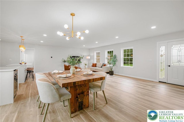 1647 4th St, Bethlehem Twp, PA 18020 - dining space with light wood finished floors, recessed lighting, a chandelier, baseboards, and beverage cooler