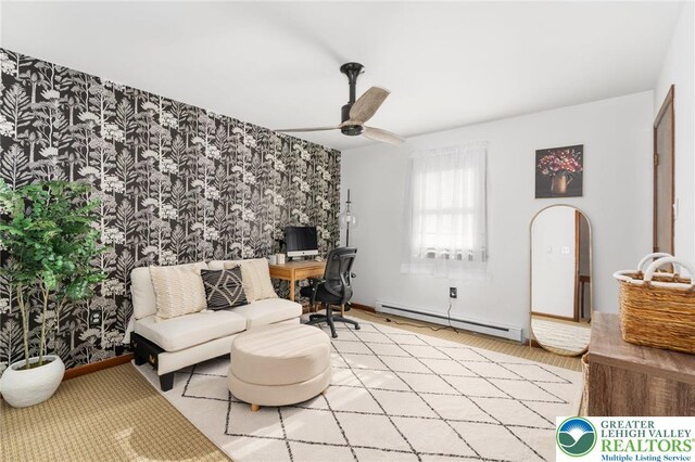 64 Autumn Ln, Penn Forest Twp, PA 18229 - home office with a baseboard heating unit, a ceiling fan, wood finished floors, and an accent wall
