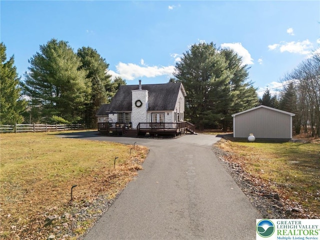 64 Autumn Ln, Penn Forest Twp, PA 18229 - view of front of home featuring a deck, driveway, and an outdoor structure