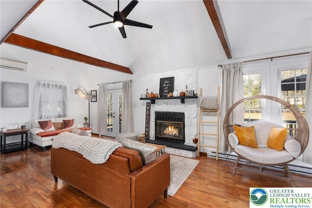64 Autumn Ln, Penn Forest Twp, PA 18229 - living room with a wall unit AC, a ceiling fan, a stone fireplace, wood finished floors, and a textured ceiling