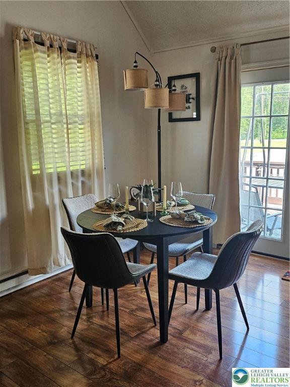 64 Autumn Ln, Penn Forest Twp, PA 18229 - dining area featuring hardwood / wood-style floors, plenty of natural light, and vaulted ceiling