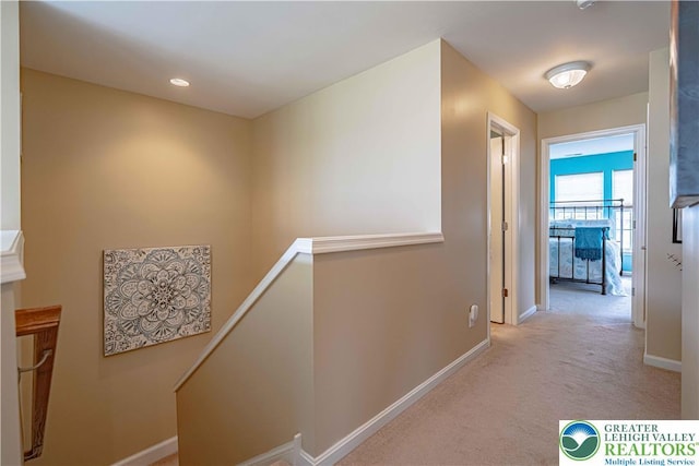 8592 Cascade Rd, Upper Macungie Twp, PA 18031 - corridor with an upstairs landing, light carpet, and baseboards