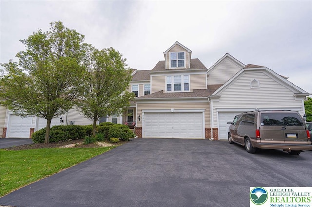 8592 Cascade Rd, Upper Macungie Twp, PA 18031 - townhome / multi-family property featuring asphalt driveway, brick siding, a garage, and a shingled roof
