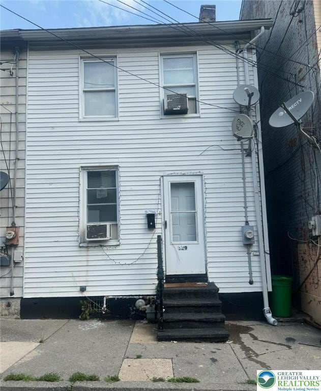 129 W Sycamore St, Allentown City, PA 18102 - view of front of home with entry steps and a chimney