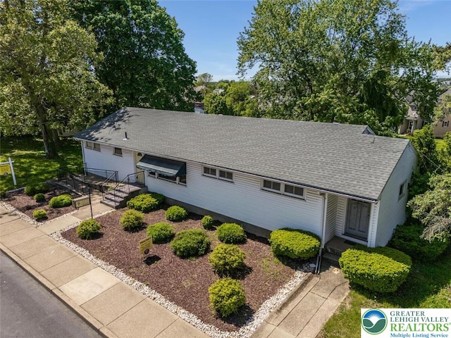 825 Old Philadelphia Rd, Easton, PA 18042 - view of front of property with a shingled roof, a chimney, and view of scattered trees