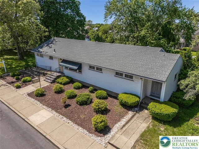 825 Old Philadelphia Rd, Easton, PA 18042 - view of front of property featuring a shingled roof, a chimney, and view of scattered trees