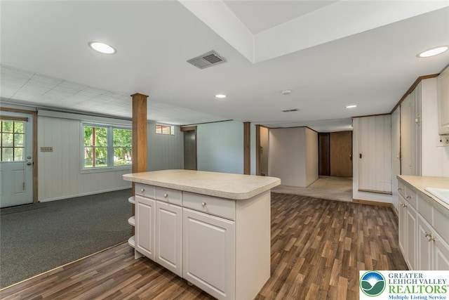 825 Old Philadelphia Rd, Easton, PA 18042 - kitchen with light countertops, dark wood-style floors, white cabinets, a kitchen island, and recessed lighting