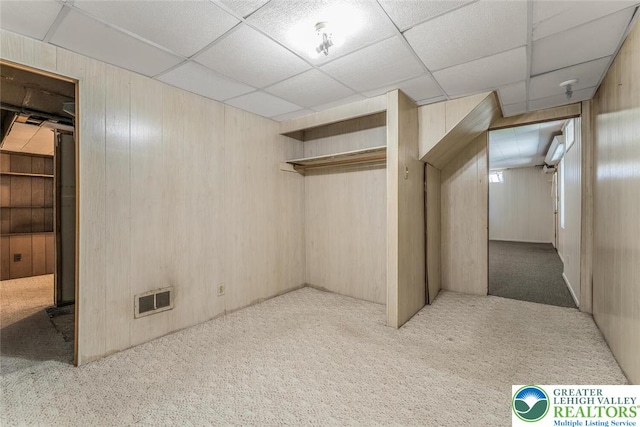 825 Old Philadelphia Rd, Easton, PA 18042 - basement featuring carpet floors, wood walls, and a drop ceiling