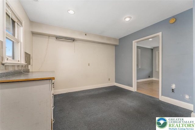 825 Old Philadelphia Rd, Easton, PA 18042 - unfurnished living room with baseboards, dark colored carpet, and recessed lighting