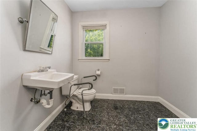 825 Old Philadelphia Rd, Easton, PA 18042 - half bathroom featuring toilet and baseboards