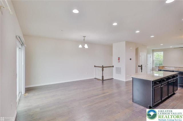 2179 Cook Dr, Bethlehem Twp, PA 18045 - kitchen featuring light wood-style floors, recessed lighting, baseboards, and open floor plan