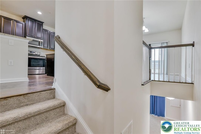 2179 Cook Dr, Bethlehem Twp, PA 18045 - staircase with wood finished floors and recessed lighting