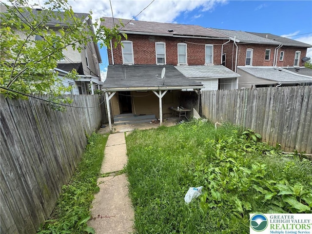 226 Adrain St, Emmaus Boro, PA 18049 - rear view of property featuring a fenced backyard and brick siding