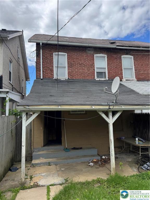 226 Adrain St, Emmaus Boro, PA 18049 - rear view of house with brick siding and a shingled roof