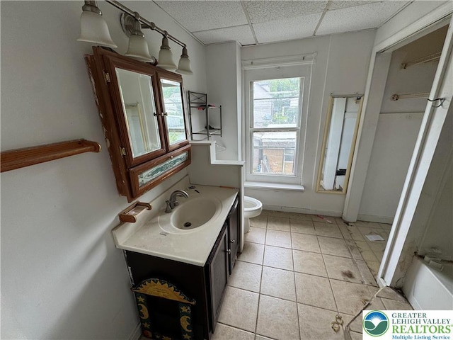 226 Adrain St, Emmaus Boro, PA 18049 - bathroom featuring vanity, toilet, a paneled ceiling, and tile patterned flooring