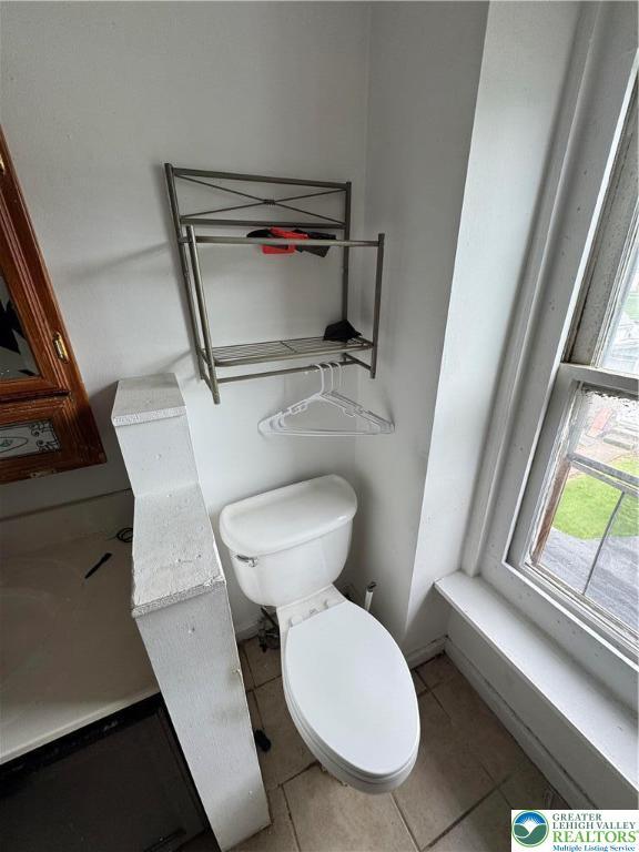226 Adrain St, Emmaus Boro, PA 18049 - half bathroom with toilet, tile patterned flooring, and baseboards