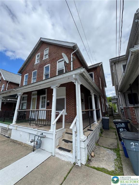 226 Adrain St, Emmaus Boro, PA 18049 - view of property with brick siding and covered porch