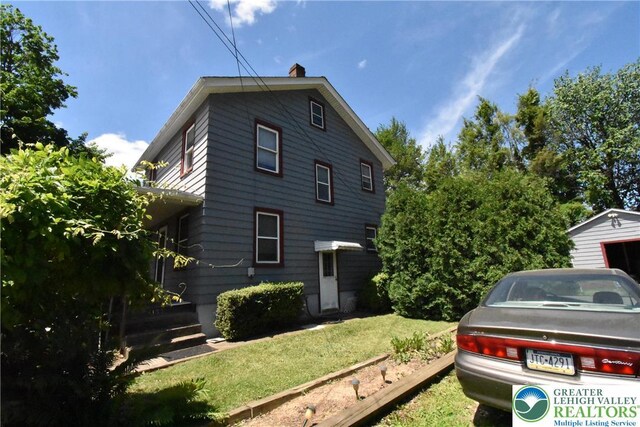 4133 Bayard St, Easton, PA 18045 - view of home's exterior with a lawn and a chimney
