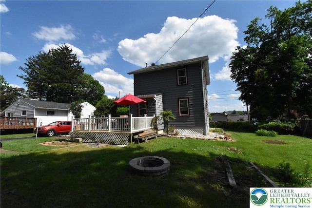 4133 Bayard St, Easton, PA 18045 - rear view of house featuring a fire pit, a deck, and a yard
