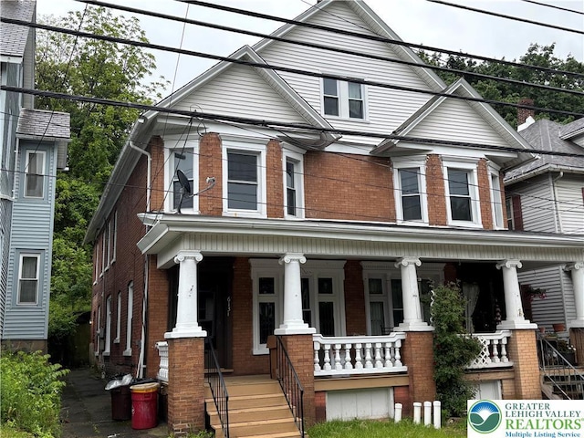 613 S Main St, Bangor Borough, PA 18013 - view of front facade featuring brick siding and a porch