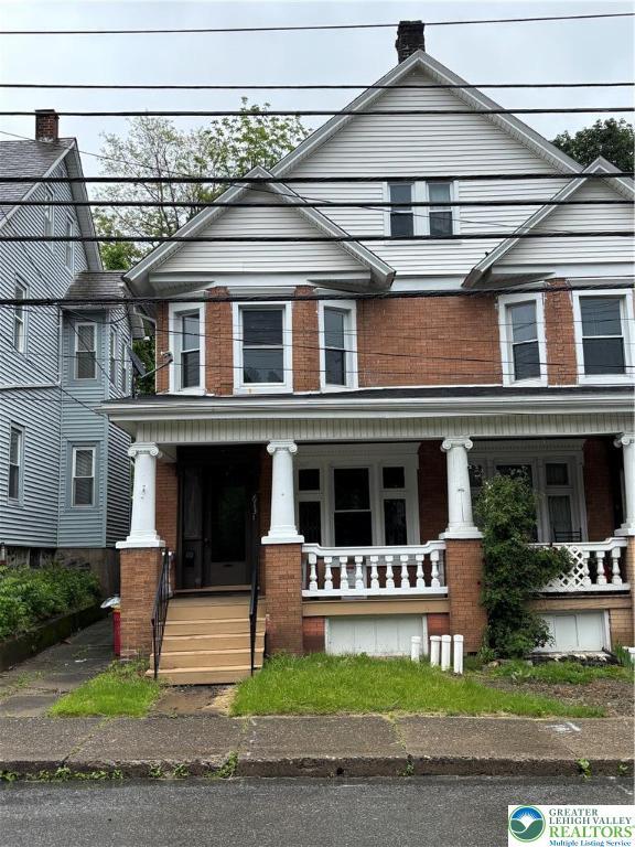 613 S Main St, Bangor Borough, PA 18013 - view of property featuring a porch and brick siding