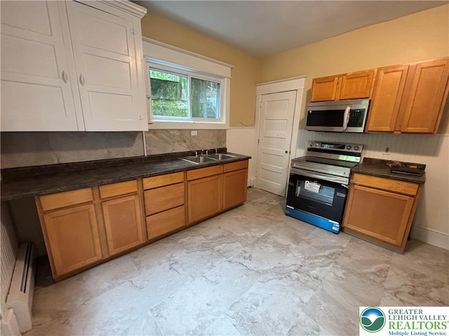 613 S Main St, Bangor Borough, PA 18013 - kitchen featuring stainless steel appliances, a sink, decorative backsplash, and dark countertops