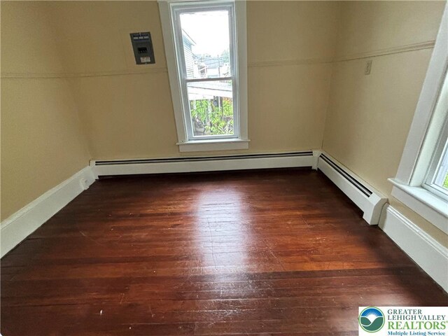 613 S Main St, Bangor Borough, PA 18013 - empty room with a baseboard heating unit and wood-type flooring