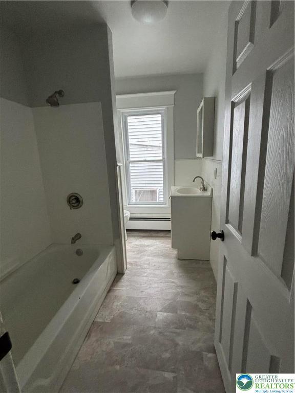 613 S Main St, Bangor Borough, PA 18013 - bathroom featuring toilet, a baseboard radiator, vanity, and shower / bath combination