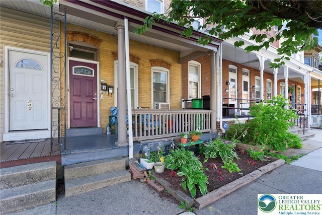 343 N 16th St, Allentown City, PA 18102 - view of exterior entry with a porch and brick siding
