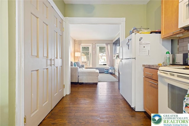 343 N 16th St, Allentown City, PA 18102 - kitchen featuring white appliances, dark wood-style floors, brown cabinets, and open floor plan