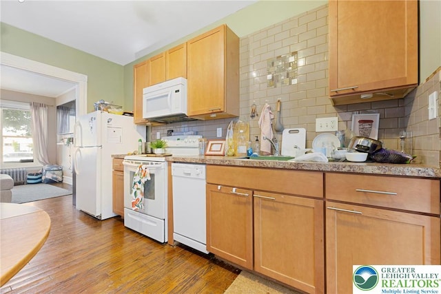 343 N 16th St, Allentown City, PA 18102 - kitchen with white appliances, a sink, light countertops, and backsplash