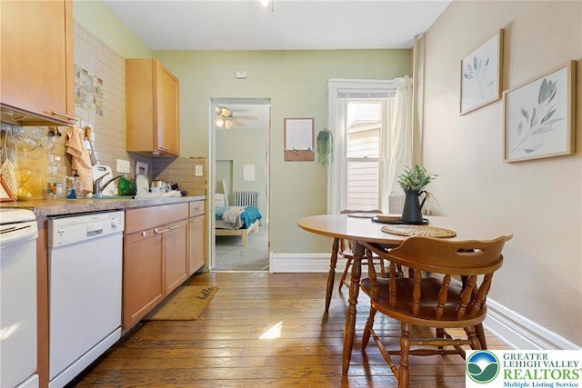 343 N 16th St, Allentown City, PA 18102 - kitchen with white appliances, dark wood finished floors, decorative backsplash, light countertops, and baseboards