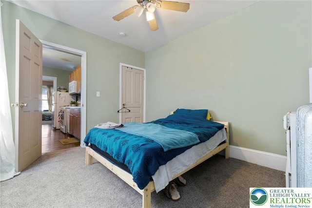 343 N 16th St, Allentown City, PA 18102 - bedroom with light colored carpet, a ceiling fan, and freestanding refrigerator