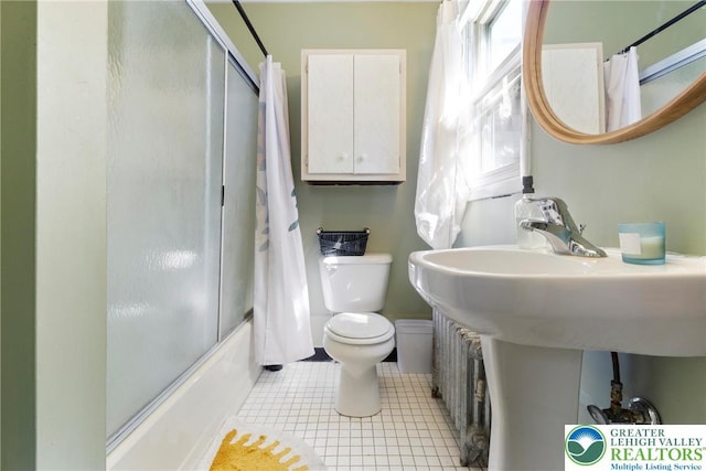343 N 16th St, Allentown City, PA 18102 - full bath featuring toilet, bath / shower combo with glass door, and tile patterned floors