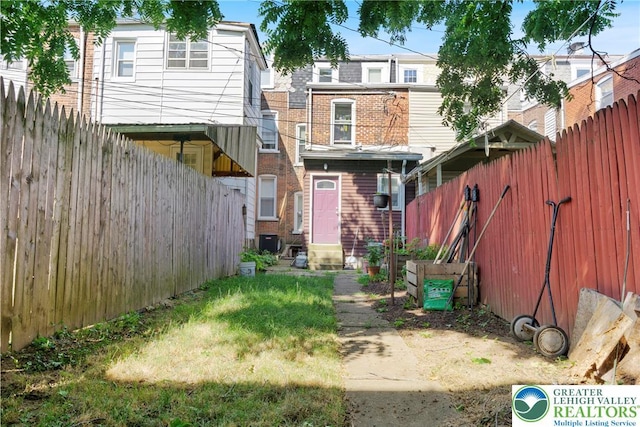 343 N 16th St, Allentown City, PA 18102 - rear view of property featuring brick siding, entry steps, and central air condition unit