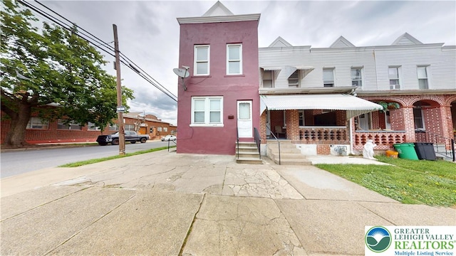 853 N Jordan St, Allentown City, PA 18102 - townhome / multi-family property featuring a porch and stucco siding