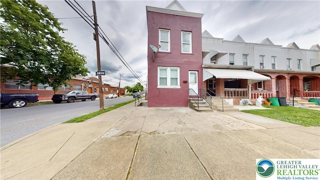 853 N Jordan St, Allentown City, PA 18102 - view of property featuring stucco siding and covered porch