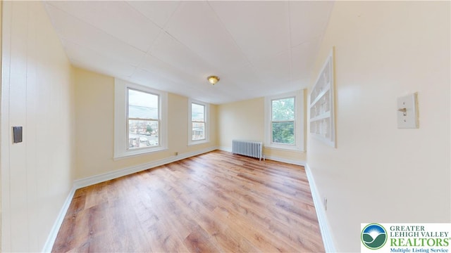 853 N Jordan St, Allentown City, PA 18102 - spare room featuring radiator heating unit, wood finished floors, and baseboards