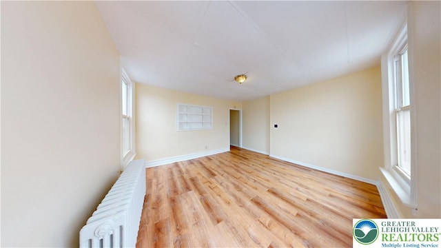 853 N Jordan St, Allentown City, PA 18102 - unfurnished room with radiator, wood finished floors, and baseboards