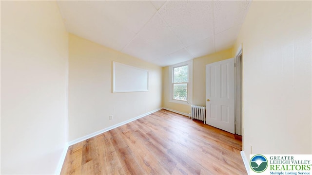 853 N Jordan St, Allentown City, PA 18102 - spare room with radiator heating unit, wood finished floors, and baseboards