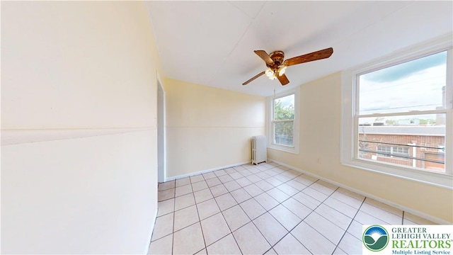 853 N Jordan St, Allentown City, PA 18102 - spare room with radiator, ceiling fan, light tile patterned flooring, and baseboards