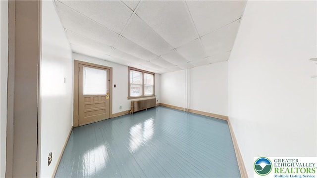 853 N Jordan St, Allentown City, PA 18102 - spare room featuring radiator, baseboards, wood-type flooring, and a drop ceiling