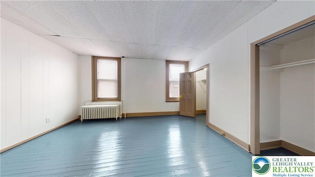 853 N Jordan St, Allentown City, PA 18102 - unfurnished bedroom featuring radiator heating unit, hardwood / wood-style floors, and baseboards