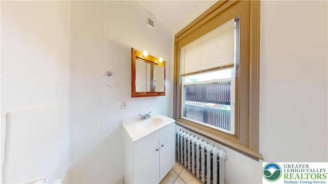853 N Jordan St, Allentown City, PA 18102 - bathroom with vanity, radiator heating unit, and tile patterned flooring