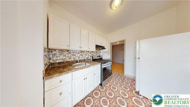 853 N Jordan St, Allentown City, PA 18102 - kitchen featuring gas range, freestanding refrigerator, under cabinet range hood, a sink, and white cabinets