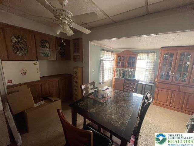 10 Springridge Rd, Moore Twp, PA 18014 - dining area featuring carpet flooring, a ceiling fan, and a paneled ceiling