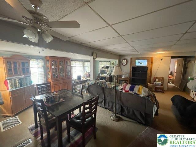 10 Springridge Rd, Moore Twp, PA 18014 - carpeted dining space featuring a ceiling fan and a drop ceiling