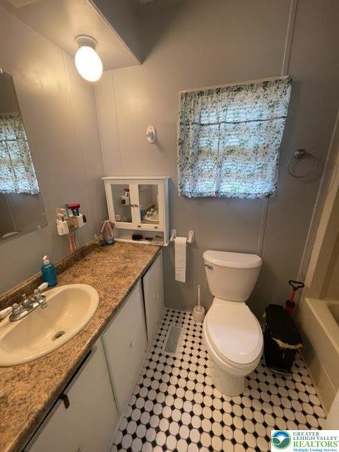 10 Springridge Rd, Moore Twp, PA 18014 - full bathroom featuring vanity, toilet, tile patterned flooring, and healthy amount of natural light