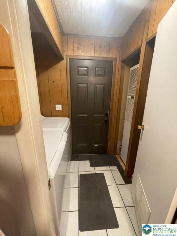 10 Springridge Rd, Moore Twp, PA 18014 - bathroom featuring wood walls, tile patterned flooring, and toilet