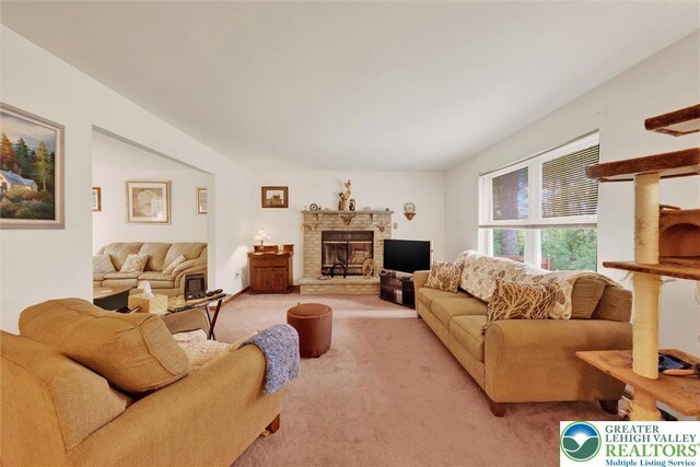 146 Bernadette Dr, Pike, PA 18328 - living area with light colored carpet and a glass covered fireplace